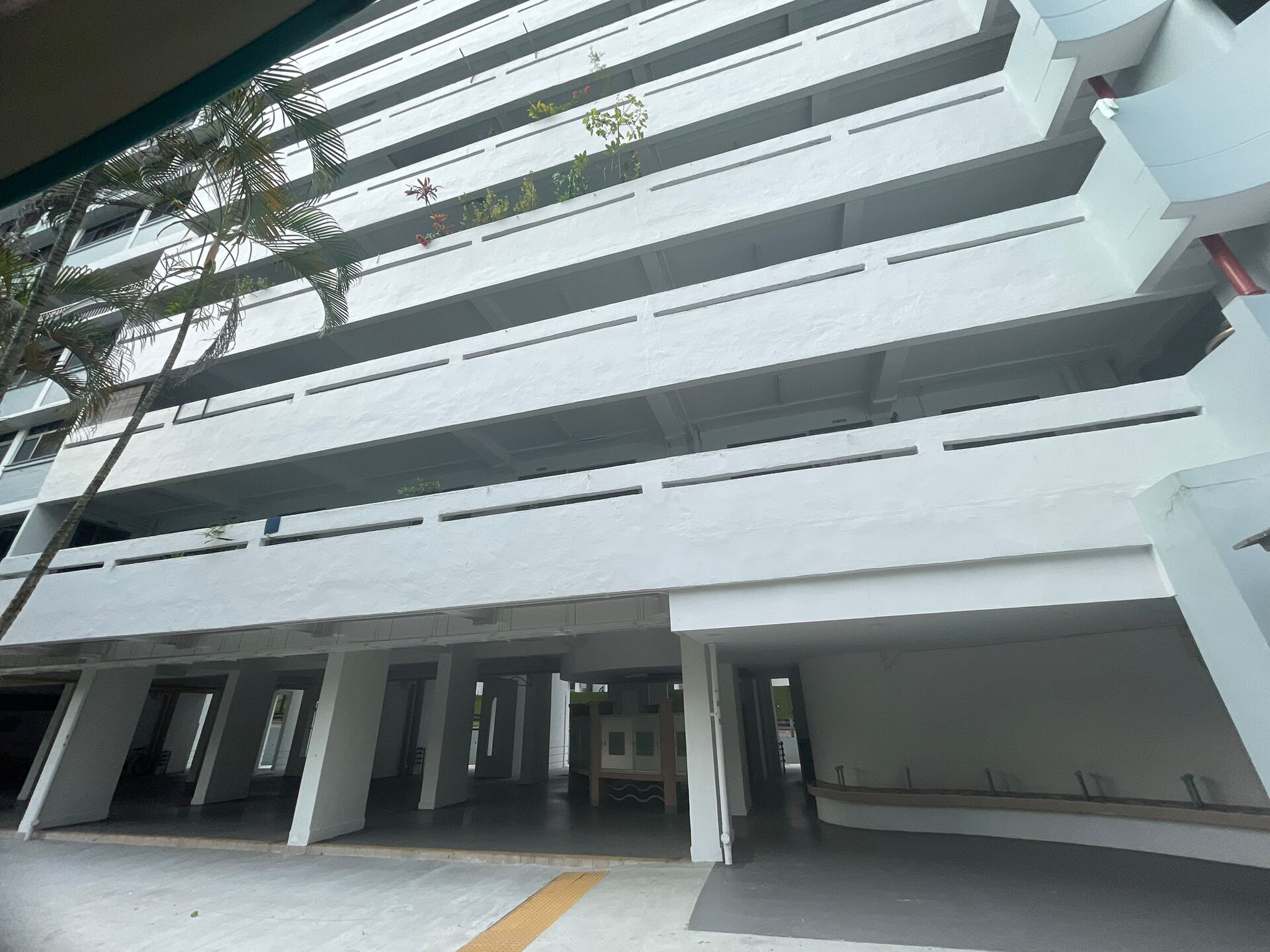 this is a HDB block that shows the lift lobby and it aso shows how tall the building is